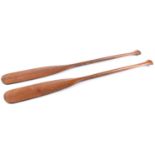 Treen. A pair of paddles, early 20th c, 122cm l Good condition for age