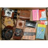 A quantity of vintage cameras, to include Agfa, Ensign and a pair of Dollond, field glasses, leather