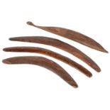 Australia. Three aboriginal wood boomerangs and a woomera, 20th c, one boomerang with ink
