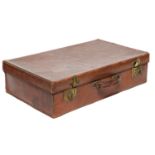 A brown leather suitcase, with brass lever locks, stamped with initials E. A. M., 66cm w, 40cm d,