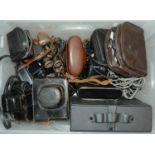 A quantity of vintage cameras, to include Zenit, Rank, Aldis, Ilford and binoculars, etc Poor