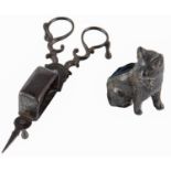 A spelter cat novelty pin cushion, c1900, 71mm h and a pair of George III steel wick trimmers,