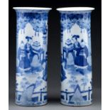 A pair of Chinese blue and white sleeve vases,   late 19th c, painted with continuous scenes of