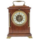 A brass mounted mahogany and line inlaid mantel clock, c1900, with primrose enamel chapter ring,
