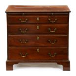 An early George III mahogany bachelor's chest, c1770, the oversailing top above brushing slide and