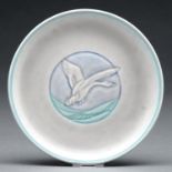 A Pilkington's Royal Lancastrian carved eggshell glazed plate  by William S Mycock, 1936, with a