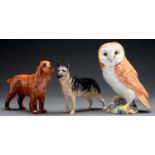 A Beswick model of a barn owl, 19cm h, printed mark and two Beswick models of dogs (3) Good
