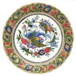 A Hungarian earthenware charger, probably Fischer, late 19th c, decorated in bright enamels with a