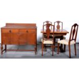 An oak draw leaf dining table, contemporary sideboard and set of four Queen Anne style dining