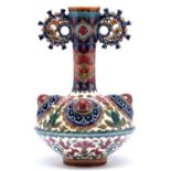 A Zsolnay vase, late 19th c, the flared neck with round handles above four reticulated bosses,