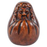 A Japanese boxwood okimono of Daruma, Meiji period, 90mm h Pleasing old colour and patina with