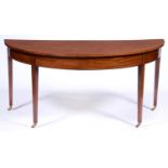 A George III mahogany side table, originally one end of a dining table, with flame figured top, on