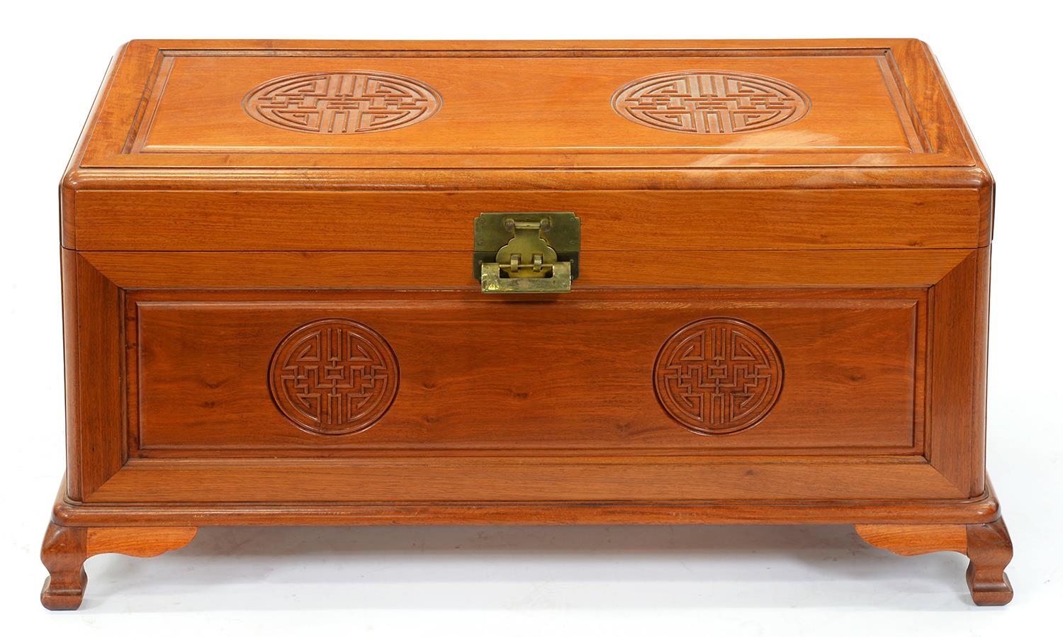 A Chinese camphor wood chest, 20th c,  carved with shou characters, ogee feet, 46cm h; 43 x 88cm