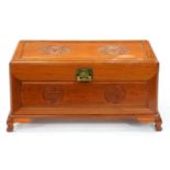 A Chinese camphor wood chest, 20th c,  carved with shou characters, ogee feet, 46cm h; 43 x 88cm
