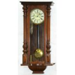 A walnut  Vienna wall clock, late 19th c, the cavetto flared cornice above arched glazed door,