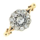 A diamond cluster ring, in gold marked 18ct, 2g, size L Hoop worn