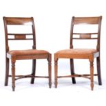 A pair of George III mahogany dining chairs, with tablet centred back rail and slip seat, on