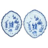 A graduated pair of Chinese export blue and white leaf shaped meat dishes, c1770, painted with two