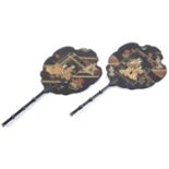 A pair of Victorian japanned papier-mache face screens, with ebonised bamboo shaped handle, 39.5cm l