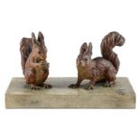 Two Viennese cold painted bronze sculptures of red squirrels, early 20th c,  mounted on shagreen