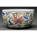 A Chinese wucai bowl, painted to the interior with lotus and auspicious characters, the exterior