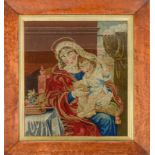 A Berlin woolwork picture of the Virgin and Child, 19th c, 40 x 33.5cm, maple frame Good