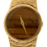 A  Bueche Girod 9ct gold lady's wristwatch,  with tiger's eye dial, 24mm, 9ct gold textured