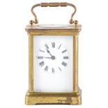 A French brass carriage timepiece, early 20th c, with enamel dial, 10.5cm h, stamped lion trademark,