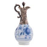 A Continental silver mounted blue and white porcelain scent flask and stopper, 19th c, of ewer