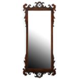 A mahogany fretted frame mirror, late 19th / early 20th c, in George II style, 128 x 55cm Repaired