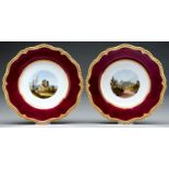 A pair of Flight, Barr & Barr claret ground dessert plates, c1825, painted with a central view in