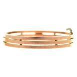 A gold bangle, early 20th c, 55mm (internal), 15.6g Good condition with only a few light wear