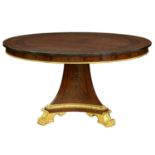 A parcel gilt and inlaid mahogany table in the style of Thomas Hope, 77cm h; 137cm diam Good