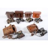 Six pairs of binoculars, first half 20th c, leather cases Average condition