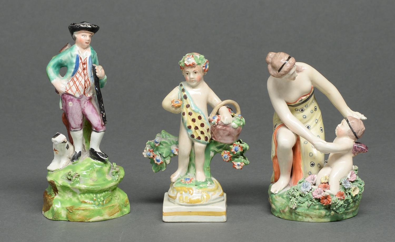 Two Staffordshire earthenware figures and a group of Venus and Cupid, c1830 and mid 19th c, the last