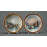 A pair of Crown Derby plates, 1884, painted with fishing boats on a lake at dawn or at night, in