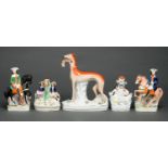 A Staffordshire earthenware model of a greyhound with hare, pair of highwaymen flatback figures