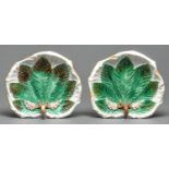 A pair of George Jones leaf shaped majolica dessert dishes, moulded with a horse chestnut leaf and