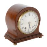 A mahogany and broken line inlaid mantel clock, early 20th c, the silvered dial inscribed MADE IN