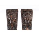 A pair of carved oak lion mask corbels, 18th c,  11.5cm h Both with wear, one especially on the