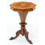A Victorian walnut worktable, with octagonal lid and carved tripod, 69cm h; 46 x 46cm Restored