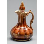 A Rockingham decorated brown glazed and gilt ale jug and stopper, Isaac and Alfred Baguley, c1842-