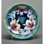 A Moorcroft Orchid dish, c1945-49, 21.5cm diam, impressed marks, painted signature Good condition