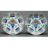 A pair of English Delftware plates, possibly Bristol, c1780, painted in blue, red and green