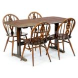 An Ercol dark stained ash dining table and set of four chairs, table 71cm h; 74 x 135cm Wear and