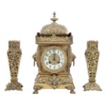 A French cast brass clock, late 19th c, the pillar shaped case with primrose enamel chapter ring