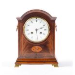 A breakarched mahogany and inlaid mantel clock, c1910, with enamel dial and gong striking