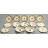 A Royal Worcester dessert service, 1930-31, printed and painted with a central group of flowers