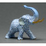A Herend model of an elephant, with gilt tusks,  blue fishnet design, 9 x 13cm, Herend mark 6 in