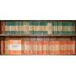 An extensive collection of Penguin books, orange and green, various editions, mainly 1950's and